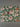 Floral and leaf patterned paper on fawn linen tea towel